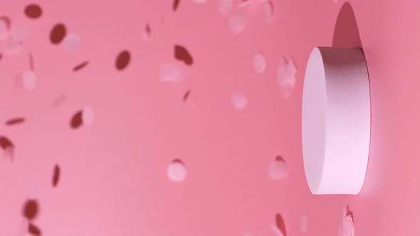 Cosmetics Product Mockup with Confetti Falling on Pink Background in Slow Motion