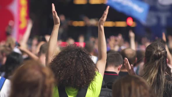 Iconic Rock Concert Front Row Crowd Cheering Hands in Air