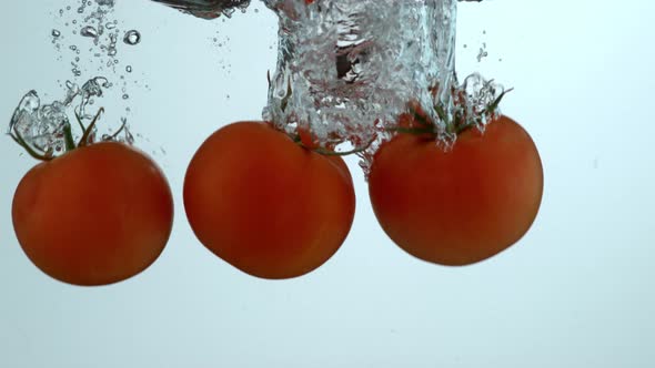 Tomatoes splashing into water in slow motion; shot on Phantom Flex 4K at 1000 fps