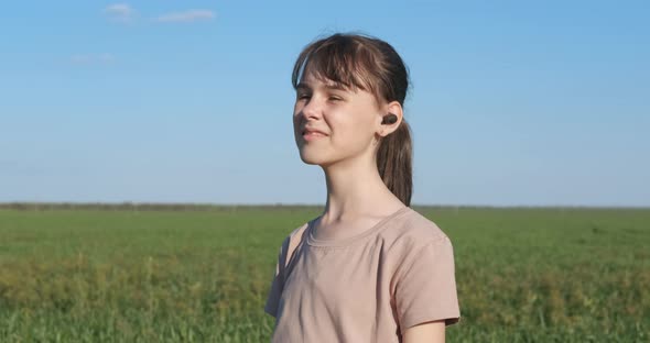 Teen with Wireless Earbuds