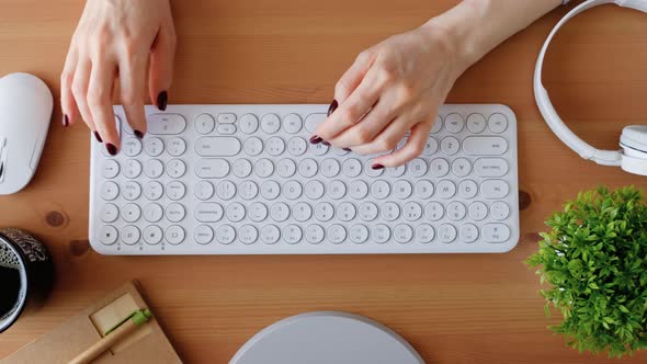 Woman typing on computer keyboard. Closeup 4k footage