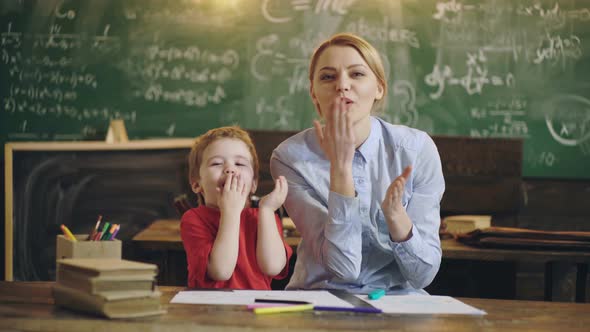 Preschool Kid. Cute Little Boy Studying at the Class with a Teacher.