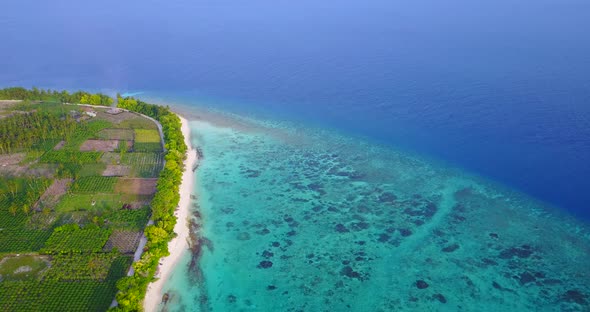 Natural fly over abstract shot of a white paradise beach and aqua blue ocean background in best qual