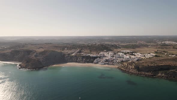 Small beach of Praia de Burgau, Algarve. Panoramic aerial of the coastline