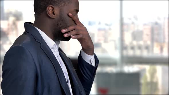 Tired Dark-skinned Businessman Having Migraine.