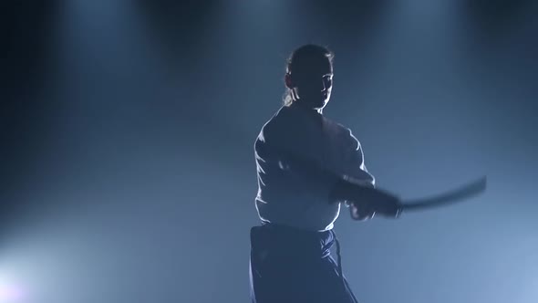 Man Fighting at Aikido Training with Japanese Sword Katana in Martial Arts School. Healthy Lifestyle