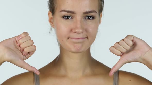 Thumbs Down, Close up of Failed Beautiful Girl, White Background