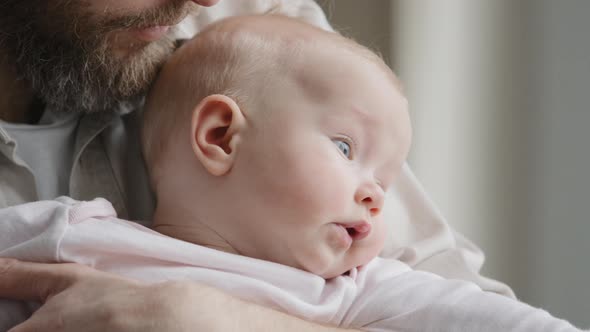 Unrecognizable Bearded Father Daddy Caring Parent Holding Caucasian Baby Kissing Child Head