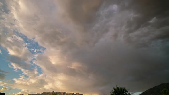 Timelapse of clouds moving through the sky during sunset