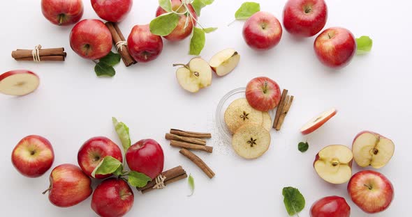 Red Natural Apples with Slice and Leafs Cinnamon Concept on White Background