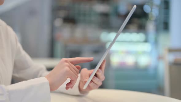 Side View of Woman Using Tablet Close Up