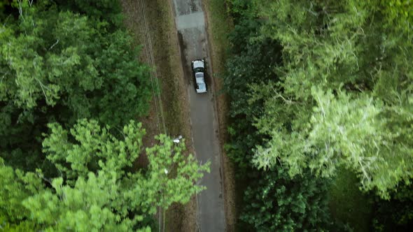 Gray car on the road. Sky view of summer road with cars. Aerial view country road in summer 