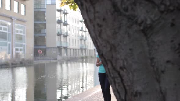 Woman in the city of London holding mobile phone