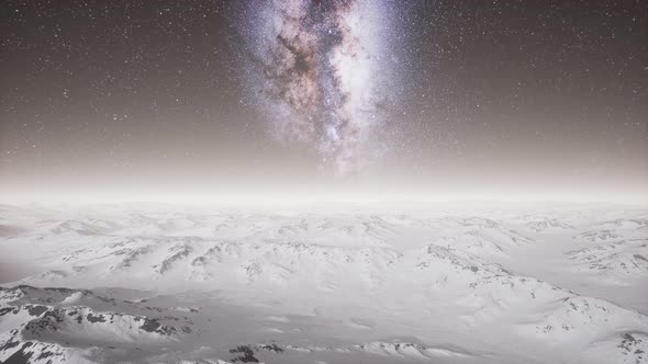 Milky Way Above Snow Covered Terrain alt