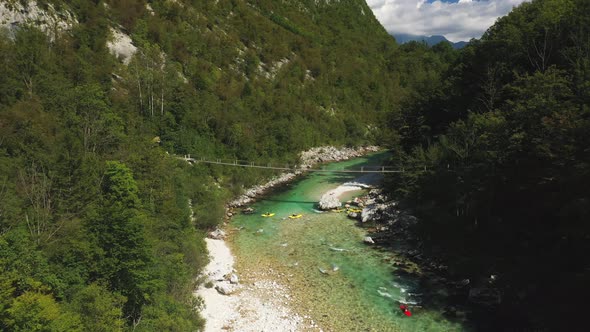 Drone Flight Over Kayaks And Bridge Over River