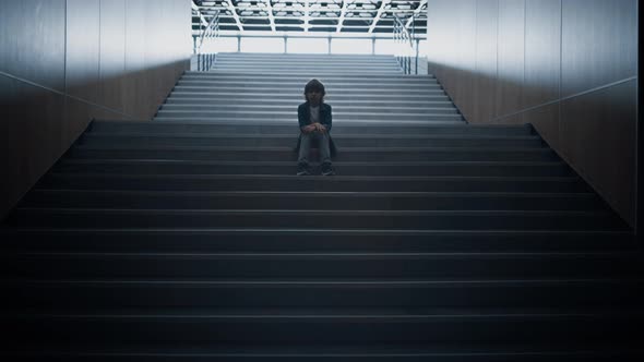 Unhappy Schoolboy Sitting Staircase Alone Close Up