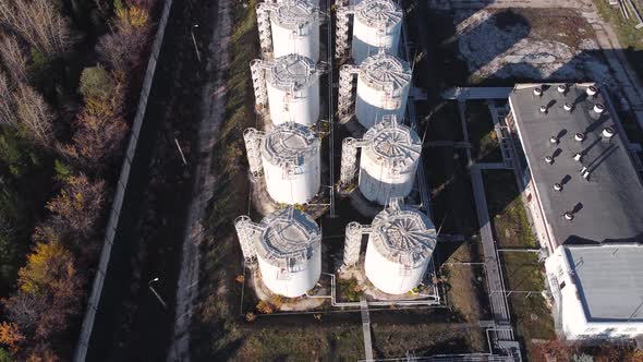 Aerial view of the station with vertical tanks for storing fuel.