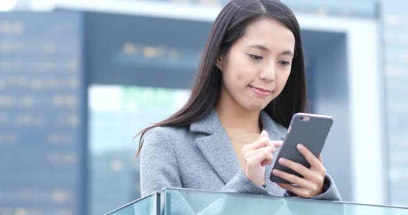 Woman use of mobile phone at night