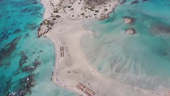 Aerial bird view of a paradise beach with umbrellas. Location for holidays