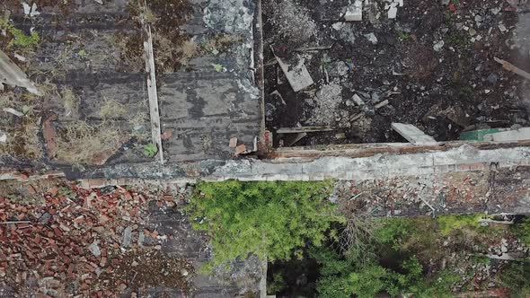 Ruins of abandoned old broken industrial factory or warehouse buildings after disaster