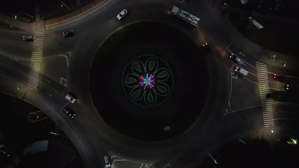 Aerial View Timelapse of Roundabout Road with Circular Cars at Night in Small European City