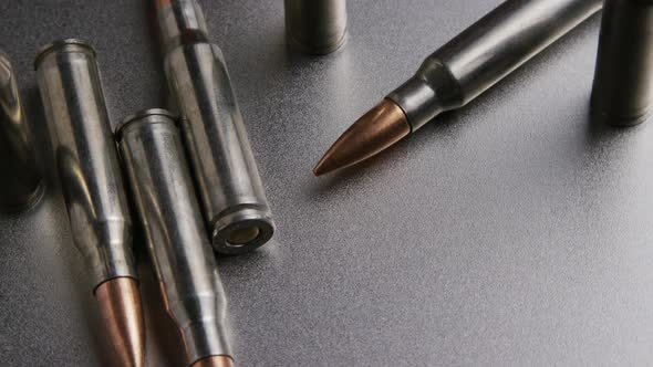 Cinematic rotating shot of bullets on a metallic surface - BULLETS 006