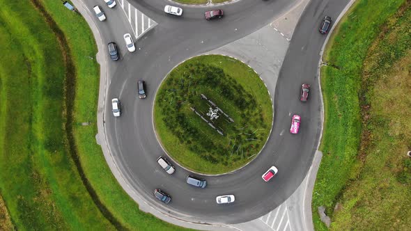 Cars Drive Around Large Turning Circle in Rural Area