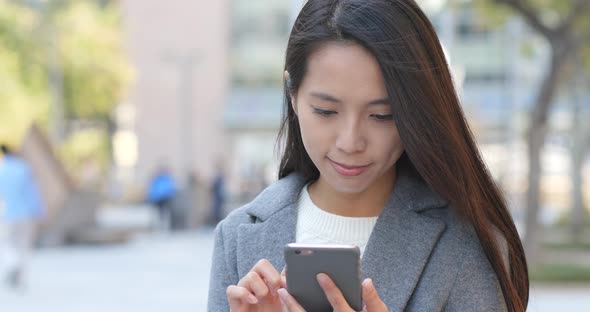 Business woman use of cellphone at outdoor