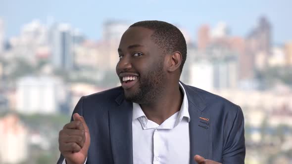 Funny African-american Man on Blurred Background.