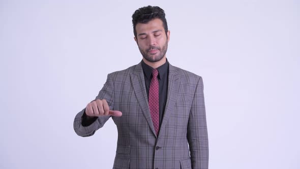 Sad Bearded Persian Businessman Giving Thumbs Down
