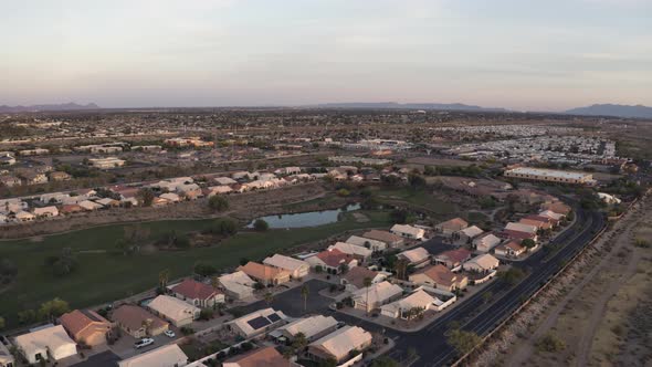 Flying Above Houses at Sunset 