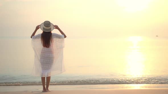 Asian woman enjoy around beautiful beach sea ocean