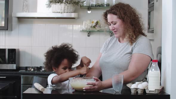 Mixed Family Baking  Funny Black Little Girl and Her White Mother Making Dough in the Bowl