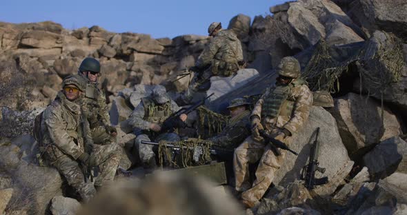 Soldiers Taking a Break From Patrol alt