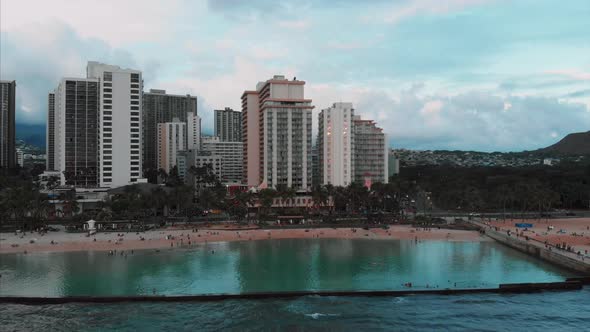 Aerial drone footage of Honolulu, Hawaii. Beautiful real estate, buildings in the city. Palm trees