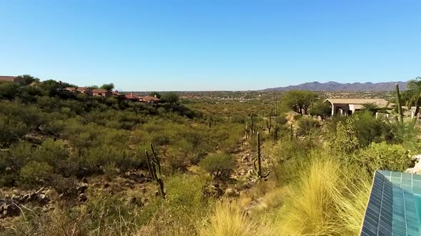 Drone shot over pool into the desert in Arizona