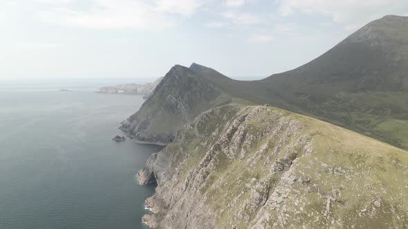 Rocky Green Slopes Of The Majestic Mountains In Achill Island - aerial shot