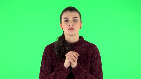 Woman Looking at Camera with Anticipation, Then Very Upset. Green Screen