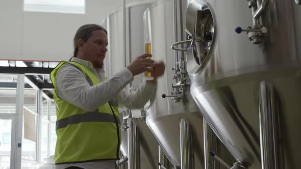 Caucasian man working at a microbrewery