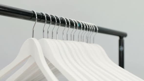 Hangers arranged on clothes rack 4K 4k
