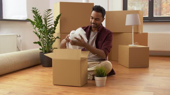 Indian Man Packing Boxes and Moving To New Home 3