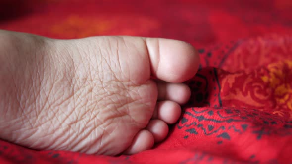 Close Up of Dry Child Feet on Bed 