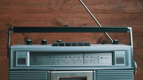 Girl's Hand Twists and Presses the Buttons on the Retro Radio Tape Recorder