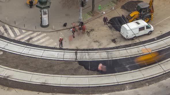 Construction Site of Avenue with Asphalt Paver Roller and Truck Aerial Timelapse