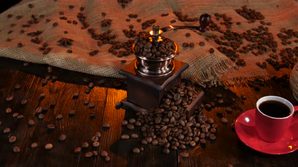 Coffee Grinder Full of Coffee Beans and Cup of Espresso