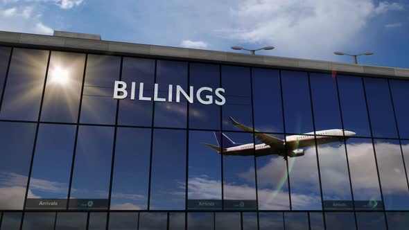 Airplane landing at Billings Montana, USA airport mirrored in terminal