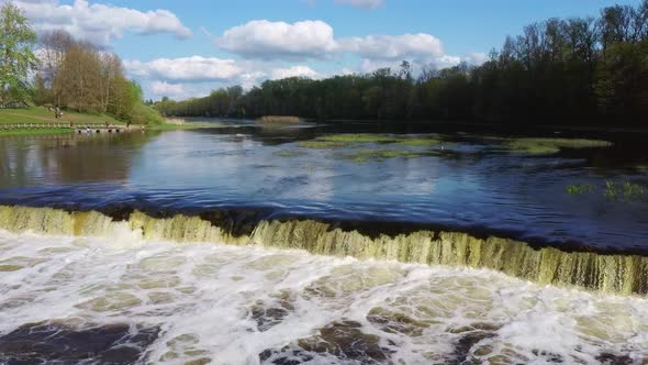Flying Fish at Ventas Rumba The Widest Waterfall in Europe in Latvia Kuldiga, Aerial Dron Shot