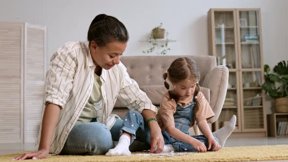 Woman Doing Puzzles with Child