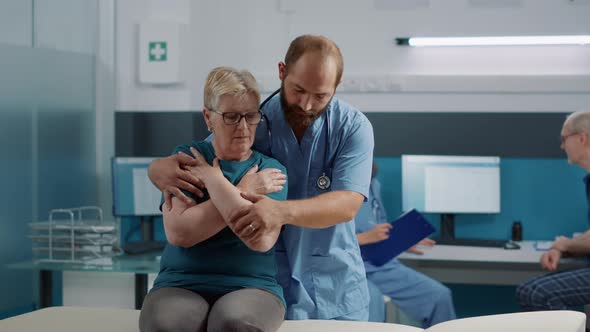 Orthopedic Specialist Practicing Bones Cracking on Senior Patient