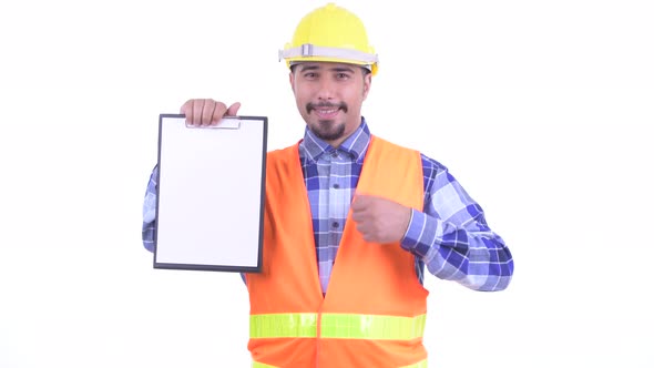 Happy Bearded Persian Man Construction Worker Showing Clipboard and Giving Thumbs Up